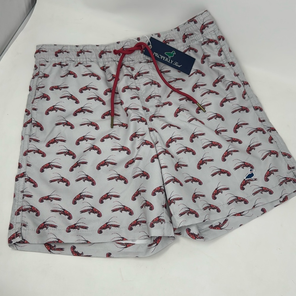 New properly tied boys swim trunks - Crawfish Season Youth Large YL
Ships fast